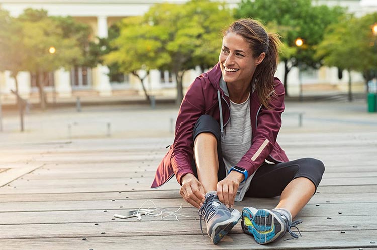 Top Dos & Don’ts of Maintaining Healthy Veins 2 woman putting on her shoes scaled min