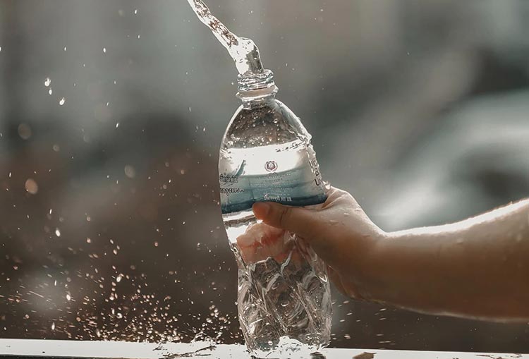 man holding a water bottle